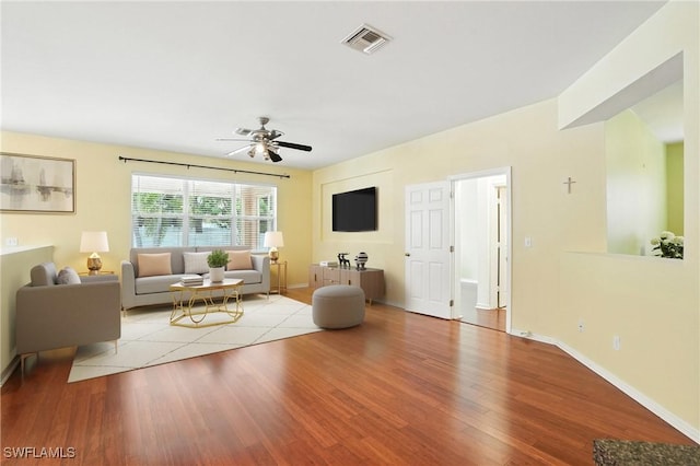 10043 Winding River Rd, Punta Gorda, FL 33950 - living area with wood finished floors and a ceiling fan