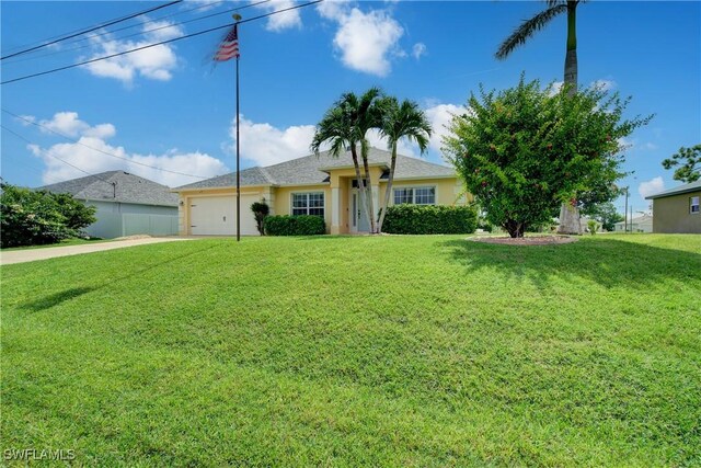2116 NW 24th Ave, Cape Coral, FL 33993 - single story home featuring a front lawn, an attached garage, concrete driveway, and stucco siding