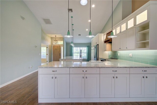 2116 NW 24th Ave, Cape Coral, FL 33993 - kitchen featuring white cabinetry, light stone countertops, open shelves, hanging light fixtures, and glass insert cabinets