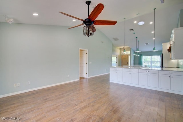 2116 NW 24th Ave, Cape Coral, FL 33993 - unfurnished living room featuring high vaulted ceiling, ceiling fan, light wood-style flooring, and recessed lighting