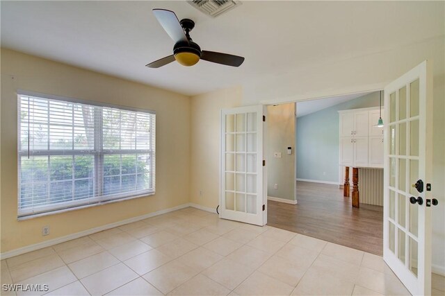 2116 NW 24th Ave, Cape Coral, FL 33993 - spare room featuring french doors and a ceiling fan