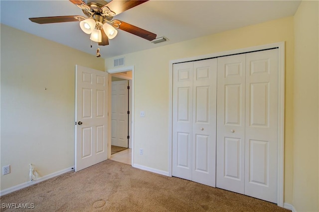 2116 NW 24th Ave, Cape Coral, FL 33993 - unfurnished bedroom featuring carpet, a closet, and ceiling fan