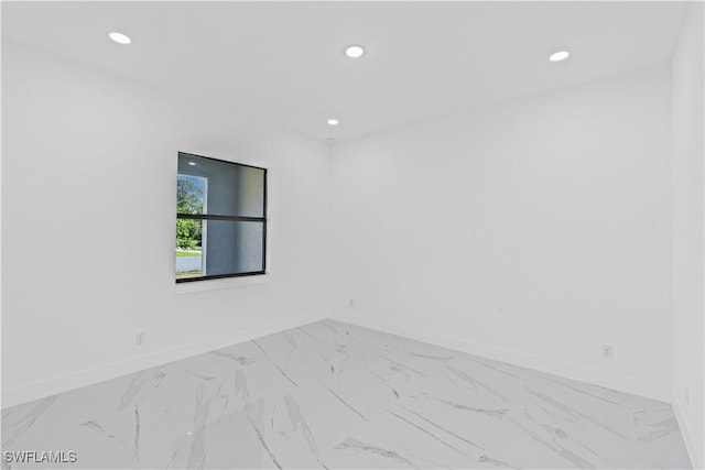 3200 44th St W, Lehigh Acres, FL 33971 - empty room with marble look tiles and recessed lighting
