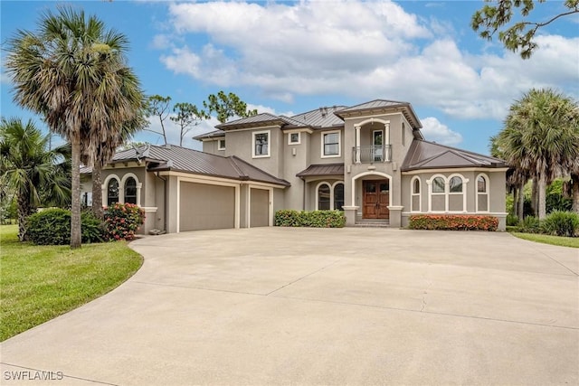 3917 La Vida Way, Cape Coral, FL 33993 - mediterranean / spanish home with a standing seam roof, stucco siding, driveway, and a garage