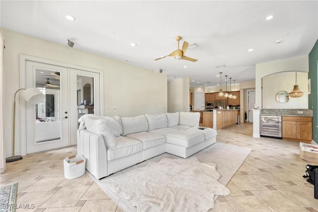 3917 La Vida Way, Cape Coral, FL 33993 - living area with beverage cooler, a ceiling fan, and recessed lighting