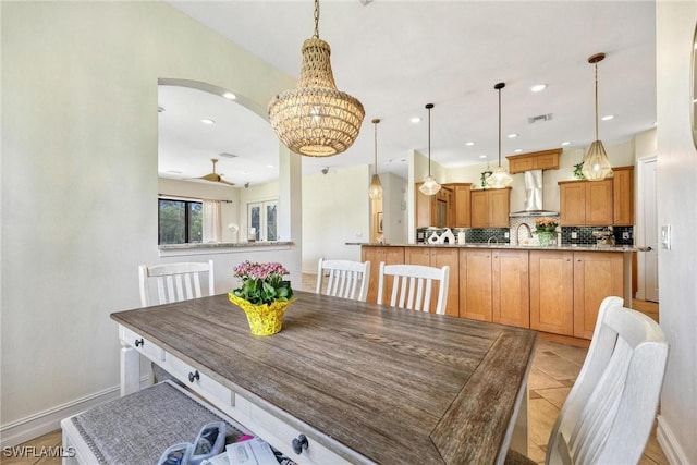 3917 La Vida Way, Cape Coral, FL 33993 - dining space featuring recessed lighting, a chandelier, and arched walkways