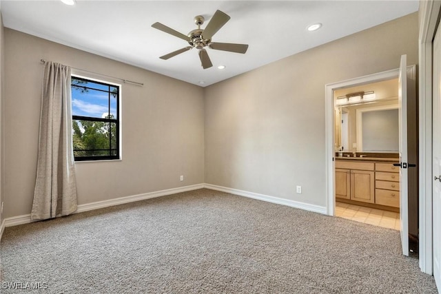 3917 La Vida Way, Cape Coral, FL 33993 - unfurnished bedroom featuring light colored carpet, recessed lighting, ensuite bathroom, and a ceiling fan
