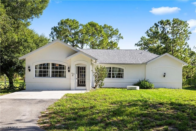 3715 41st Ave NE, Naples, FL 34120 - ranch-style house featuring a front lawn, stucco siding, and a shingled roof
