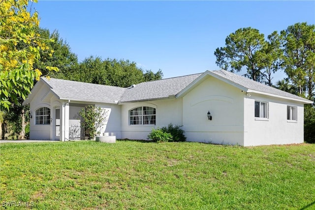 3715 41st Ave NE, Naples, FL 34120 - view of front of property with a front yard and stucco siding