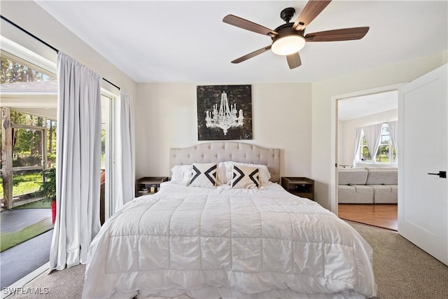 3715 41st Ave NE, Naples, FL 34120 - carpeted bedroom with access to exterior and a ceiling fan