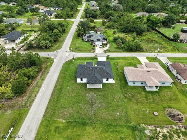 3219 43rd St W, Lehigh Acres, FL 33971 - aerial view of property and surrounding area with nearby suburban area