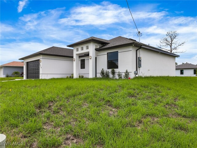 3219 43rd St W, Lehigh Acres, FL 33971 - view of front of house with stucco siding, a garage, and a shingled roof