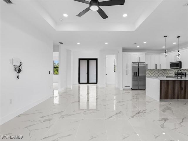 3219 43rd St W, Lehigh Acres, FL 33971 - unfurnished living room featuring recessed lighting, a raised ceiling, and a ceiling fan