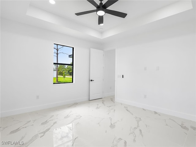 3219 43rd St W, Lehigh Acres, FL 33971 - empty room with a raised ceiling, ceiling fan, recessed lighting, and marble finish floors