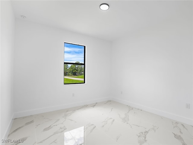 3219 43rd St W, Lehigh Acres, FL 33971 - empty room featuring light marble finish floors