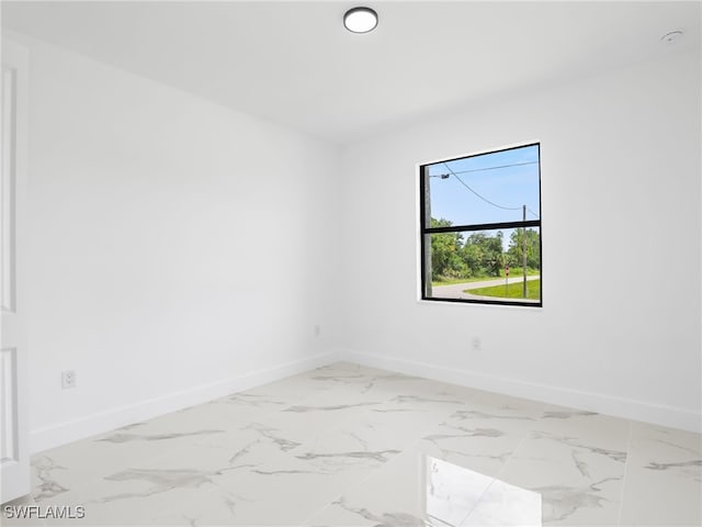 3219 43rd St W, Lehigh Acres, FL 33971 - spare room with marble finish floors