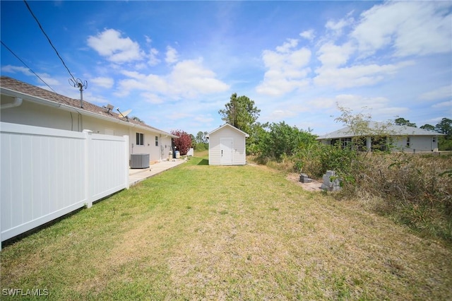 823 Portland St E, Lehigh Acres, FL 33974 - view of yard featuring a storage shed