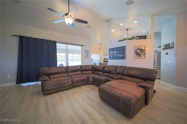 823 Portland St E, Lehigh Acres, FL 33974 - living room with light wood-type flooring, a ceiling fan, high vaulted ceiling, and recessed lighting