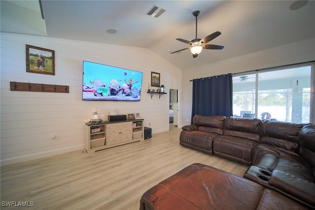 823 Portland St E, Lehigh Acres, FL 33974 - living room featuring ceiling fan, light wood-type flooring, and vaulted ceiling