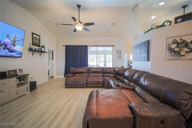 823 Portland St E, Lehigh Acres, FL 33974 - living area featuring light wood-style flooring, ceiling fan, and high vaulted ceiling
