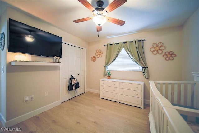 823 Portland St E, Lehigh Acres, FL 33974 - bedroom featuring light wood-style floors, a closet, and a ceiling fan