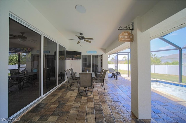 823 Portland St E, Lehigh Acres, FL 33974 - view of patio with ceiling fan, a lanai, and outdoor dining area