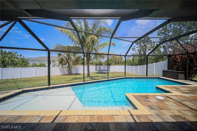 823 Portland St E, Lehigh Acres, FL 33974 - view of swimming pool with glass enclosure and a fenced backyard