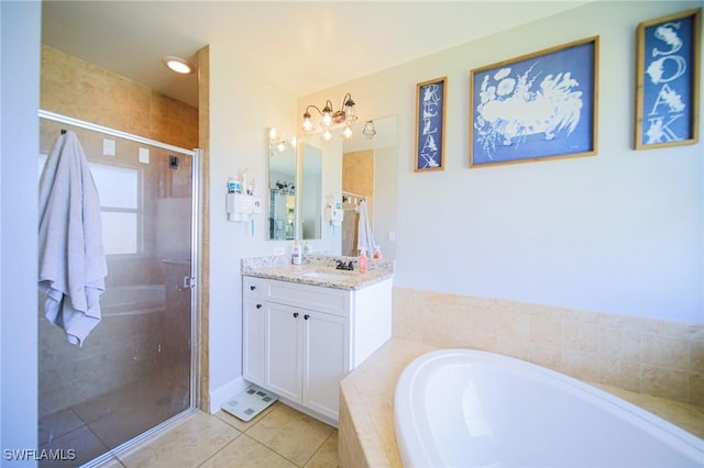 823 Portland St E, Lehigh Acres, FL 33974 - bathroom featuring vanity, a garden tub, tile patterned floors, and a stall shower