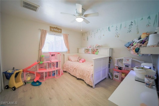 823 Portland St E, Lehigh Acres, FL 33974 - bedroom with light wood-style flooring and a ceiling fan