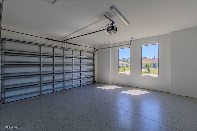 3306 40th St W, Lehigh Acres, FL 33971 - garage featuring a garage door opener