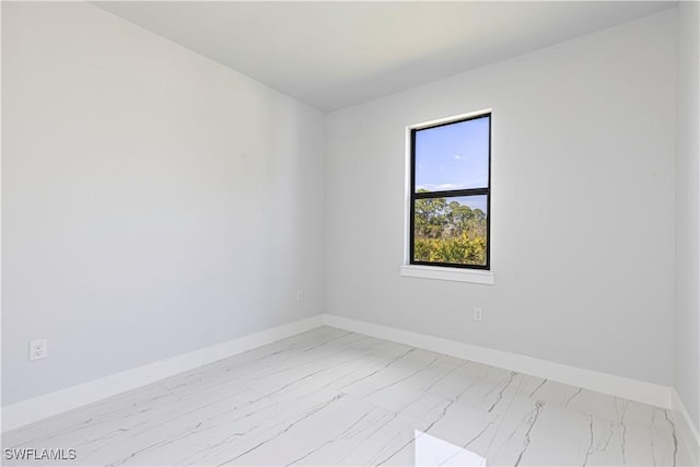 3306 40th St W, Lehigh Acres, FL 33971 - unfurnished room with marble finish floors and baseboards