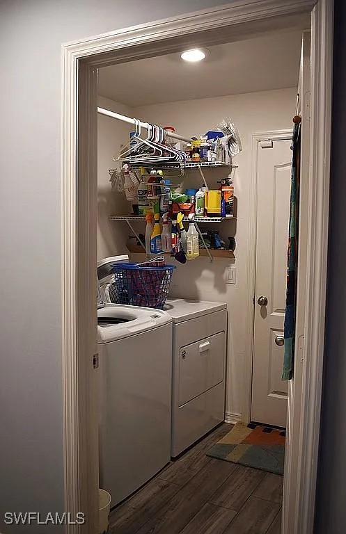 845 Lochman Dr, Fort Myers, FL 33913 - washroom featuring independent washer and dryer and dark wood finished floors