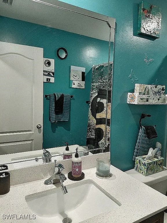 845 Lochman Dr, Fort Myers, FL 33913 - full bathroom featuring vanity
