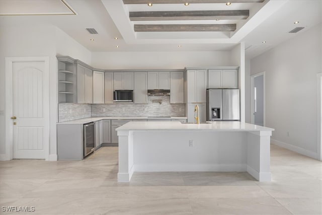 2505 43rd St SW, Lehigh Acres, FL 33976 - kitchen featuring black appliances, gray cabinets, wine cooler, open shelves, and an island with sink