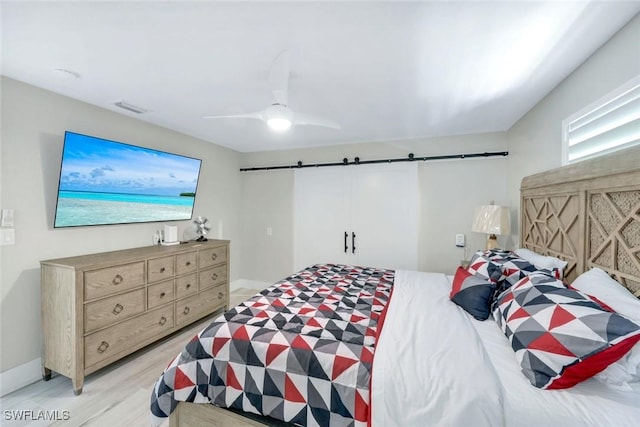 4911 Esplanade St, Bonita Springs, FL 34134 - bedroom with ceiling fan and light wood-style floors