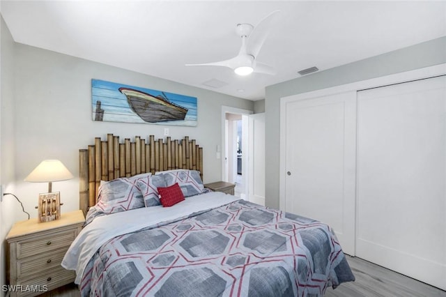 4911 Esplanade St, Bonita Springs, FL 34134 - bedroom featuring a closet, wood finished floors, and a ceiling fan