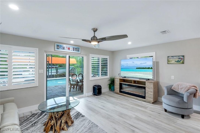 4911 Esplanade St, Bonita Springs, FL 34134 - living area with a ceiling fan, wood finished floors, and recessed lighting