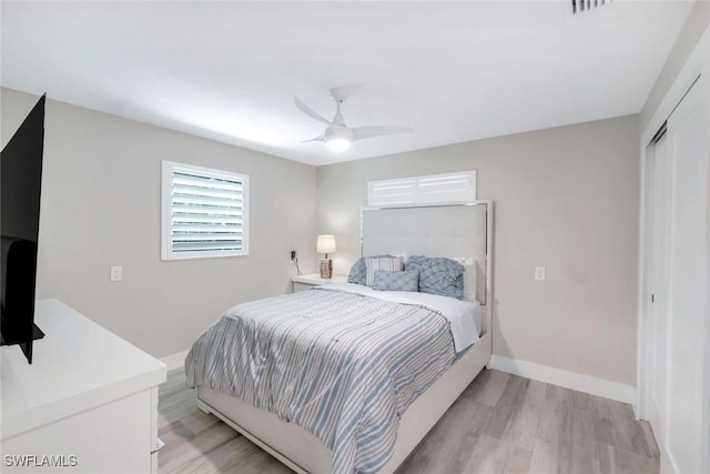 4911 Esplanade St, Bonita Springs, FL 34134 - bedroom with light wood-style flooring, a closet, and ceiling fan