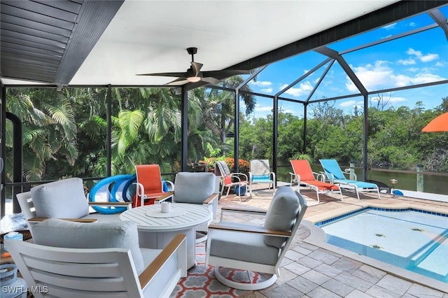 4911 Esplanade St, Bonita Springs, FL 34134 - view of patio with glass enclosure, an outdoor pool, an outdoor living space, view of scattered trees, and a water view