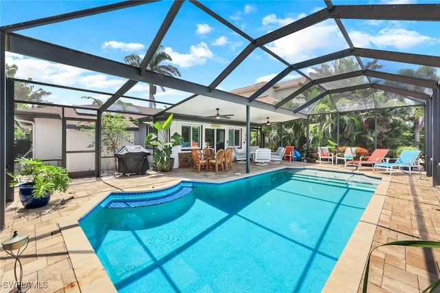 4911 Esplanade St, Bonita Springs, FL 34134 - outdoor pool featuring a grill, a patio, ceiling fan, and a lanai