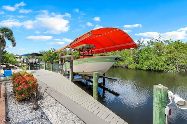 4911 Esplanade St, Bonita Springs, FL 34134 - dock featuring boat lift and a water view