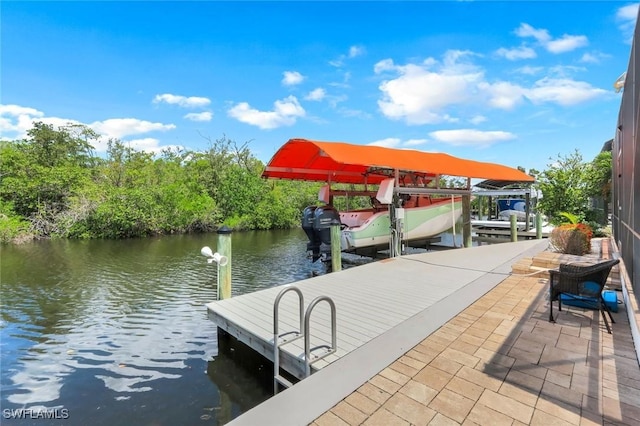 4911 Esplanade St, Bonita Springs, FL 34134 - dock area with boat lift and a water view