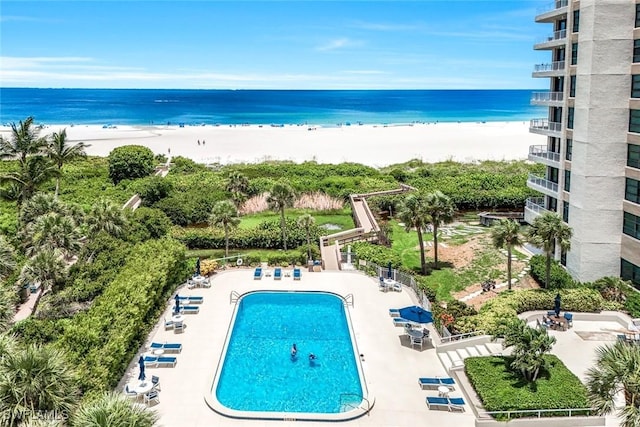 300 S Collier Blvd Unit 303, Marco Island, FL 34145 - community pool with a patio area and view of water and beach