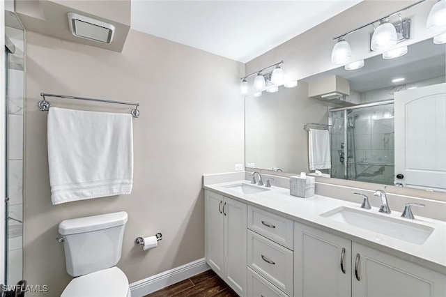 300 S Collier Blvd Unit 303, Marco Island, FL 34145 - full bath featuring double vanity, a stall shower, and wood finished floors