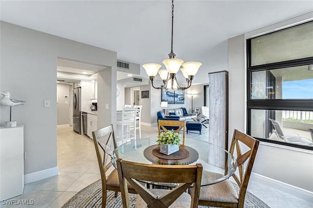 300 S Collier Blvd Unit 303, Marco Island, FL 34145 - dining room featuring a chandelier and light tile patterned flooring