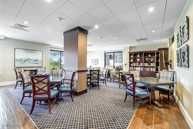 300 S Collier Blvd Unit 303, Marco Island, FL 34145 - dining area featuring baseboards and wood finished floors