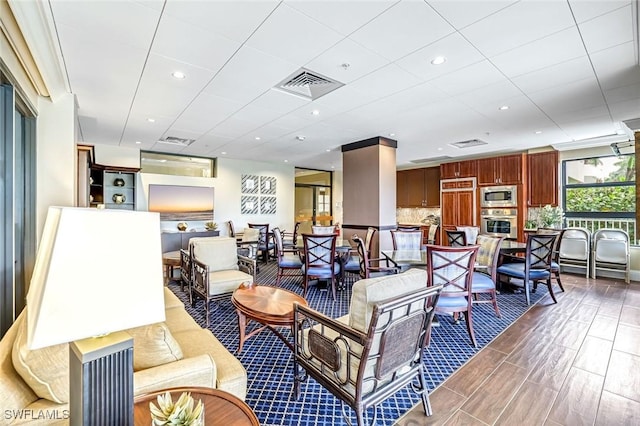 300 S Collier Blvd Unit 303, Marco Island, FL 34145 - living room with wood finished floors and recessed lighting