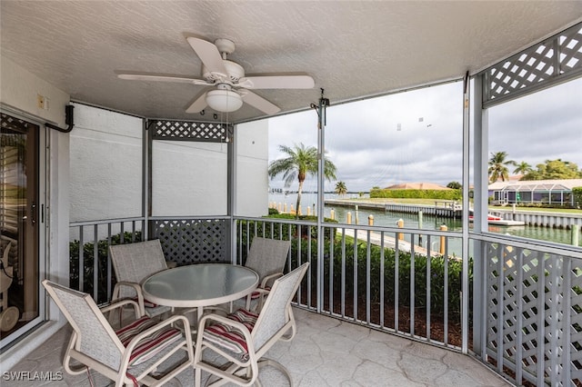 991 N Barfield Dr Unit 101, Marco Island, FL 34145 - sunroom featuring a ceiling fan and a water view