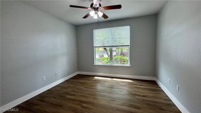 11530 Villa Grand Unit 1101, Fort Myers, FL 33913 - empty room featuring a textured wall, ceiling fan, and dark wood-style floors