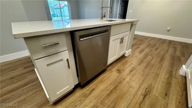 11530 Villa Grand Unit 1101, Fort Myers, FL 33913 - kitchen featuring dishwasher, white cabinetry, light stone countertops, and light wood finished floors